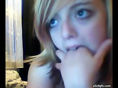 Pretty blonde teen teasing in front of the webcam